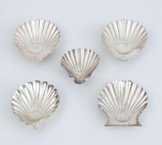 FOUR ENGLISH SILVER BUTTER SHELLS AND A SILVER-PLATED BUTTER SHELLS
