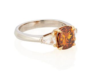 A fancy deep brown-orange diamond ring