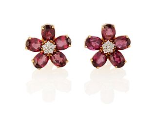 A pair of purple sapphire and diamond flower ear clips