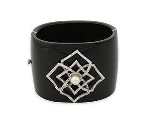 A pearl, diamond and black acrylic hinged bangle bracelet