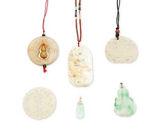 A group of six jade pendants