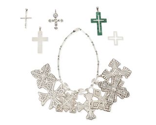 A group of silver cross pendants