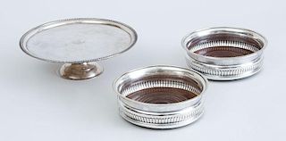 PAIR OF ENGLISH SILVER-PLATED COASTERS AND A SILVER-PLATED CRESTED AND STEMMED PLATE