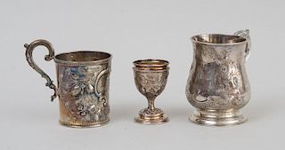 TWO REPOUSSÉ PRESENTATION SILVER MUGS AND A SILVER EGG CUP