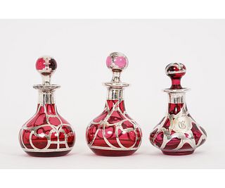 THREE SILVER OVERLAY RED BOTTLES