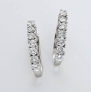Fortier 14K gold and diamond earrings.