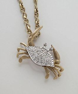 14K gold and diamond crab pendant on chain.