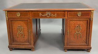 French style leather top partner's desk with inlaid and parquetry inlaid panels and bronze mounts.