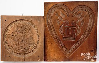 Two carved cakeboards, the larger dated 1883