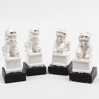 Group of Four Chinese White Glazed Porcelain Buddhistic Lion Joss Stick Holders