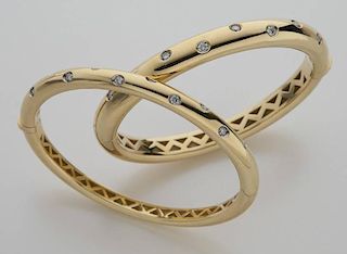 (2) Italian 18K gold and diamond bangle bracelets.