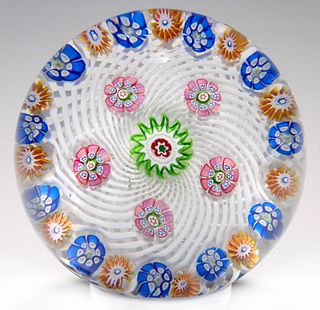A ST. LOUIS PAPERWEIGHT WITH MILLEFIORI ON WHITE SWIRL