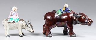 Two Chinese Porcelain Boys Atop Buffalo
