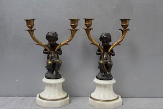 Pair of Patinated Bronze Putti Form Candlebra on