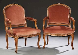 Pair of French Louis XV Style Carved Walnut Fauteu