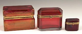 Group of Three Cranberry Glass Dresser Boxes, earl