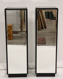 A Pair Of Ebonised Mirrored Pedestals.
