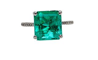 An Emerald And Diamond Engagement Ring