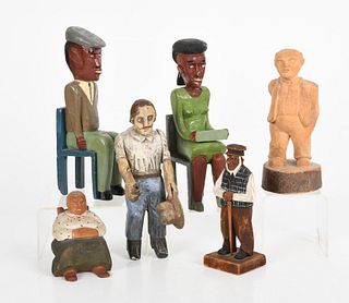 A Group of Folk Art Carved Wooden Figures