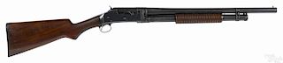 Winchester model 97 pump action riot shotgun, 12 gauge, with a walnut stock marked CYL