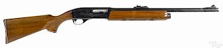 Remington model 1100 semi-automatic shotgun, 12 gauge, with a 21'' slug and a 28'' ribbed field barrel