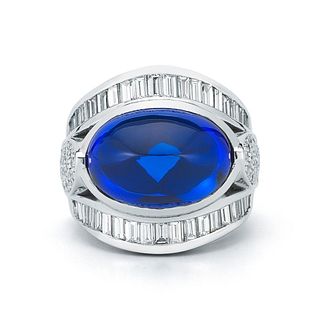 18K GOLD EAST-WEST TANZANITE OVAL CABOCHON RING