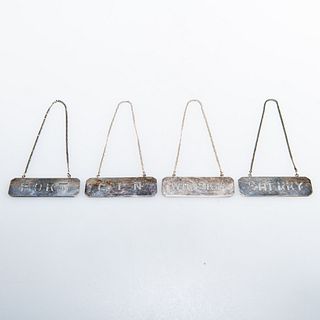 A SET OF FOUR CHINESE STERLING SILVER WINE LABELS