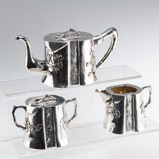 ? A CHINESE EXPORT SILVER THREE-PIECE TEA SERVICE