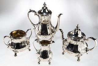 ? A VICTORIAN SILVER FOUR-PIECE TEA AND COFFEE SERVICE