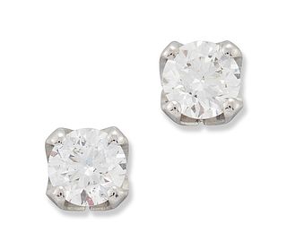A PAIR OF 18 CARAT WHITE GOLD SOLITAIRE DIAMOND EARRINGS