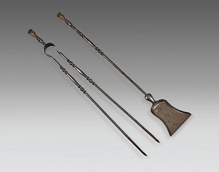 Steel fire tongs and tongs with gilt bronze knob.