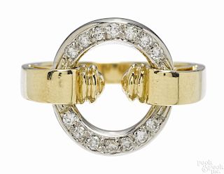 Gold and diamond saddle ring with an 18K yellow gold band and a central 18K white gold ring