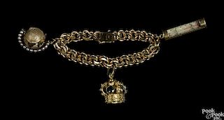 14K yellow gold charm bracelet with 14K globe and thermometer charms and an 18K yellow gold crown