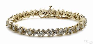 14K yellow gold and diamond tennis bracelet with round cut, brilliant diamonds