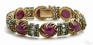 18K yellow gold, ruby, diamond, and emerald bracelet with eight ruby cabochons