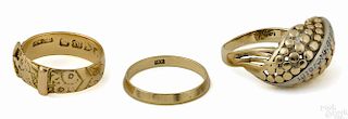 Three yellow gold rings, to include an 18K buckle ring, ring size - 6.75, 2.8 dwt, a 14K band