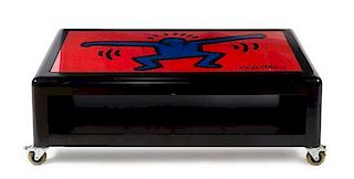 * A Keith Haring Low Table, by Bretz, CIRCA 1998, black lacquered rectangular top decorated with an iconic Keith Haring figur