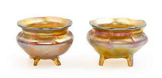 Tiffany Studios, a set of two salts, each of tapering footed form in gold iridescence