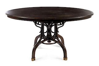 Style of Thonet, FIRST HALF 20TH CENTURY, a bentwood dining table, the oval top with a molded edge over a quadripod scroll wo