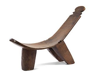 An African Carved Wood Lounge Chair Height 35 inches x depth 48 inches