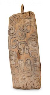 * A Carved Wooden Shield, Papua, New Guinea Height 57 x width 19 inches