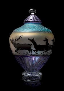 A Studio Glass Vase, 1997, of ovoid form, depicting a continuous band of elk, raised on a circular foot