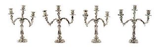 Four Silver Three-Light Candelabra, Harry Smith, Perrysville, IN, each having a baluster form standard issuing foliate candle