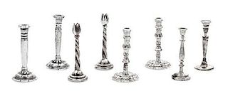 Four Pairs of Silver Candelabra, Various Makers, comprising a pair with tulip-form cups and a twisted stem; a pair having bal