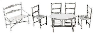 A Dutch Silver Six-Piece Dining Room Set, , comprising four chairs, a bench and a table with a cartouche form top, each raise