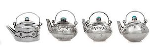 Four Native American Silver Teapots, Elizabeth Whitman, Navajo, each having a turquoise inset lid, the bodies decorated with 