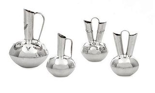 A Group of Four Native American Silver Vessels, Wesley K. Whitman, Navajo, comprising two wedding vases and a single spout ew