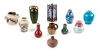 A Group of Eleven Pottery Articles Height of umbrella stand 1 5/8 inches.