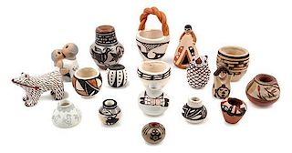 A Collection of Native American Pottery Articles Height of tallest 2 1/4 inches.