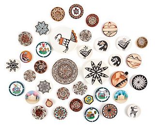 A Collection of Native American Pottery Plates Diameter of largest 2 1/4 inches.